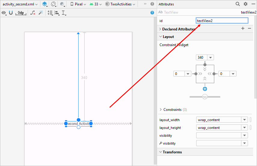 A Text View on an app in Android Studio with a red arrow pointing to the id attribute.