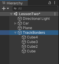 Dragging and dfopping four items onto an empty game object to create a parent/child relationship