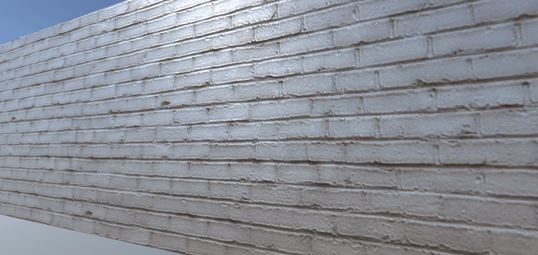 The wall in Scene view with a normal and specular map applied